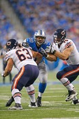 Lions defensive tackle Ndamukong Suh, centre, rushes the passer as Chicago's Roberto Garza, left, and Kyle Long block during the fourth quarter at Ford Field on November 27 , 2014 in Detroit, Michigan. The Lions defeated the Bears 34-17. (Leon Halip/Getty Images)