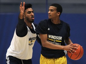 University of Windsor's Tyler Persaud, left, and Khalid Abdel-Gabar practise at the St. Denis Centre. (DAN JANISSE/The Windsor Star)