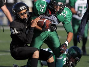 Riverside's Jason Jones, left, tackles Lajeunesse's Matthieu Pickens at Alumni Field Friday. (TYLER BROWNBRIDGE/The Windsor Star)