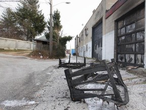 A charred couch sits in an alley in the 1200 block of Wyandotte Street East on Friday, Nov. 28, 2014. Windsor police are probing two fires that sparked up early Friday morning. (DAX MELMER/The Windsor Star)