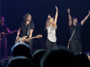 The Band Perry, from left to right, Reid, Kimberly and Neil Perry, perform at Caesars Windsor Saturday, Nov. 15, 2014. (RICK DAWES/The Windsor Star)