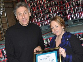Mike Brkovich, from Walkerville Brewery, left,  and Liz Farano, of the Douglas Marketing Group. The brewery has won a marketing award for their new logos. (Courtesy of the Walkerville Brewery)