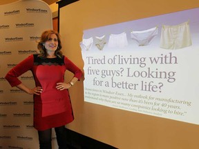 Sandra Pupatello, CEO of the WindsorEssex Economic Development Corporation is shown at a media conference on Tuesday, Nov. 18, 2014, with some of the advertising material that will be used to encourage workers to return to Windsor.(DAN JANISSE/The Windsor Star)