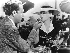 In a 1942 Hollywood movie, Paul Henreid lights a cigarette for Bette Davis in the film Now, Voyager. The Windsor Health Unit wants all films depicting smoking to be rated R.