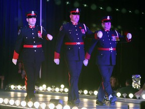 The Windsor Police honour guard kickoff the annual Cops Care for Kids fashion show at the Ciociaro Club in Tecumseh on Thursday, November 6, 2014. (TYLER BROWNBRIDGE/The Windsor Star)