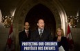 In this file photo, Peter MacKay, Minister of Justice and Attorney General of Canada speaks as Steven Blaney, Minister of Public Safety and Emergency Preparedness, back right, Lianna McDonald, Executive Director of the Canadian Centre for Child Protection, join him in making an announcement on Parliament Hill in Ottawa on Wednesday, Nov. 20, 2013., as part of Bullying Awareness Week. THE CANADIAN PRESS/Sean Kilpatrick