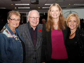 From left to right, Alzheimers Society board chair Helen Biales, Circle of 7 member Ed Agnew, Alzheimers Society CEO Sally Bennett Olczak and manager of development Peggy Winch pose for a photo at the Denim & Diamonds gala, Saturday Nov. 1, 2014, hosted at the Children's Aid Society. Proceeds went to several charities including the Alzheimers Society, Senior's Centre, Children's Aid and other Circle of 7 charities. (RICK DAWES/The Windsor Star)