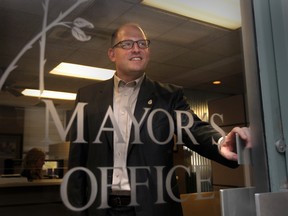 In this file photo, newly elected mayor Drew Dilkens looks out the door at his new office at Windsor City Hall on Oct 28, 2014. (JASON KRYK/The Windsor Star)