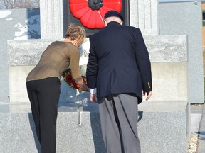 Theresa Charbonneau, mother of the late Cpl. Andrew Grenon, who was killed in 2008 while serving in Afghanistan, lays a wreath at the LaSalle cenotaph during Remembrance Day ceremonies November 11, 2014.  (JULIE KOTSIS/The Windsor Star)