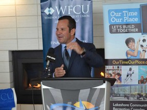 Atlas Tube Centre capital campaign chairman Barry Zekelman, from left, listens to WFCU president and CEO Marty Komsa speak during a press conference Tuesday at the Atlas Tube Centre in Lakeshore, where it was announced the aquatic centre will be named the Windsor Family Credit Union Community Pools and Splashpad. (JULIE KOTSIS/The Windsor Star)