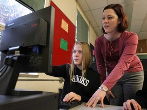 Riverside Secondary School student Sarah Snyder, 15, and teacher Aimee Demeter participated in the EQAO's online pilot project test Tuesday, Nov. 25, 2014, in Windsor. (DAN JANISSE/The Windsor Star)