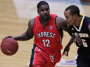 Windsor Express Tony Bennett dribbles around London Lightning Al Stewart in NBL Canada league action from WFCU Centre Wednesday November 19, 2014. (NICK BRANCACCIO/The Windsor Star)