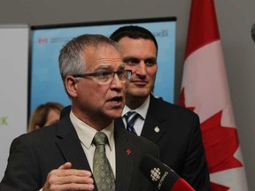 Gary Goodyear, minister of state for FedDev Ontario and   MP Jeff Watson speak during a press conference in downtown Windsor, Ontario on November 13, 2014. (JASON KRYK/The Windsor Star)