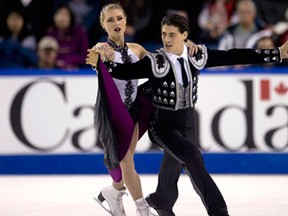 Piper Gilles and Paul Poirier, of Canada, skate during the ice dance short dance program at Skate Canada International in Kelowna, B.C., on Oct., 31, 2014. THE CANADIAN PRESS/Jonathan Hayward