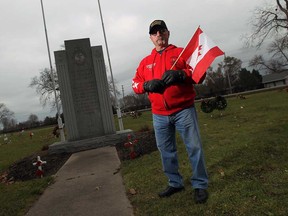 Veteran Mike Lepine is photographed in the soldiers' section of Heavenly Rest Cemetery on Nov. 26, 2014. (Tyler Brownbridge / The Windsor Star)