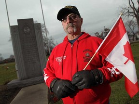 Veteran Mike Lepine is photographed in the soldiers' section of Heavenly Rest Cemetery on Nov. 26, 2014. (Tyler Brownbridge / The Windsor Star)