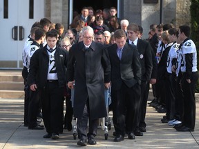 Pallbearers transfer the body of Michael Matte into a hearse during a funeral service at St. John the Baptist Church in Amherstburg, Saturday, Nov. 15, 2014.  The 17-year-old high school student was found dead on Saturday, Nov. 8, 2014, from accidental carbon monoxide poisoning in the garage of his Amherstburg home.  (DAX MELMER/The Windsor Star)