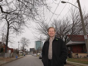 WINDSOR, ON. NOV. 26, 2014. Patrick Firth, project coordinator for the Glengarry Marentette Renewal Initiative is shown on Chatham St. E near downtown Windsor, ON. on Wed. Nov. 26, 2014. New street lighting is being installed in the neighbourhood after the group identified it as a need in the area.  (DAN JANISSE/The Windsor Star) (For story by Dave Battagello)
