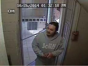 A surveillance photo released by Windsor police of a person of interest wanted in connection with the a hit and run on Pelissier Street in Windsor on Oct. 26, 2014. (HANDOUT/The Windsor Star)