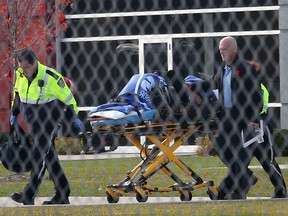 In this file photo, a worker is transported by paramedics on Monday, Nov. 3, 2014, after being involved in a industrial accident at the Syncreon plant on Pillette Rd. in Windsor, ON.  (DAN JANISSE/The Windsor Star)