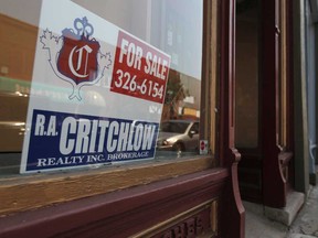 A 'for sale' sign sits in a vacant store on Talbot Street, east of Files: Erie Street in Leamington, September 1, 2011.  The block is the highlighted area for improvement as most stores stay no longer than eight months.  (DAX MELMER / The Windsor Star)