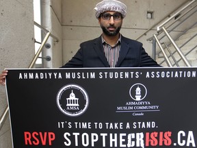 Kashif Saeed of the Ahmaddiya Muslim Students' Association at the University of Windsor holds a banner about countering the radicalization efforts of Islamic State (ISIS) militants). (Dax Melmer / The Windsor Star)