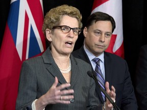 Ontario Premier Kathleen Wynne and Brad Duguid, minister of Economic Development, Employment and Infrastructure, need  to create an auto strategy and hire an automotive czar to oversee it.  THE CANADIAN PRESS/Frank Gunn