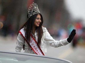 Priya Madaan, reigning Miss Canada 2014 and a nursing student at the University of Windsor, leads the Downtown Windsor BIA's Holiday Parade during Winter Fest, Saturday, Nov. 29, 2014.  Madaan was this year's Grand Marshal for the parade.   (DAX MELMER/The Windsor Star)