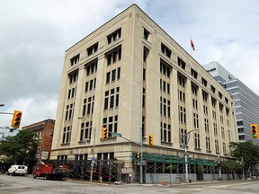 Workers inspect the Paul Martin Building on Monday, Nov. 10, 2014, in Windsor, ON. (DAN JANISSE/The Windsor Star)