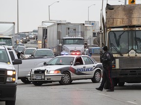 A Windsor Police car blocks the southbound lanes of Central Avenue at Temple Drive in  Windsor, Ontario after an elderly woman was struck by a front-end loader garbage truck on November 25, 2014. (JASON KRYK/The Windsor Star)