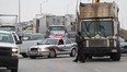 A Windsor Police car blocks the southbound lanes of Central Avenue at Temple Drive in  Windsor, Ontario after an elderly woman was struck by a front-end loader garbage truck on November 25, 2014. (JASON KRYK/The Windsor Star)