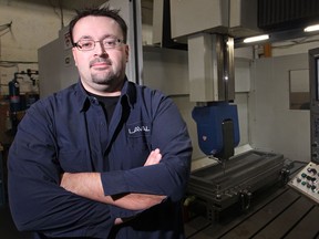 Brian Major, pictured Friday, Nov. 14, 2014, at Laval International, is in his third year of a three-year general machinist/CNC specialist apprenticeship at Laval.  Major took St. Clair's pre-apprenticeship program in 2012.  (DAX MELMER/The Windsor Star)