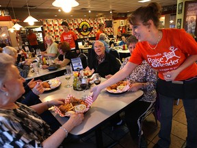 The Michigan Diner in Tecumseh, opened its doors to raise money for local literacy programs Monday, Nov. 19, 2012, donating 100 per cent of their sales to The Windsor Star's Raise-A-Reader campaign. Server Angela Finley serves up some of the food during the fundraiser.  (DAN JANISSE/The Windsor Star)