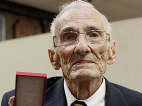 Real DeGuire with his newly awarded Knight of the National Order of the Legion of Honour medal from France, Nov. 8, 2014. (RICK DAWES/The Windsor Star)