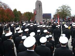 Members of H.M.C.S Hunter stand at attention while attending a Remembrance Day service at the cenotaph in downtown Windsor, Sunday, Nov. 9, 2014.(DAX MELMER/The Windsor Star)