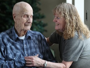 Joan Pomerleau visits with her 93-year old father, Sandy Barr, left, at Riverside Place Long Term Care, Friday, Nov. 28, 2014.  The long term care facility has received extra funding that helps decrease responsive behaviour.  (DAX MELMER/The Windsor Star)