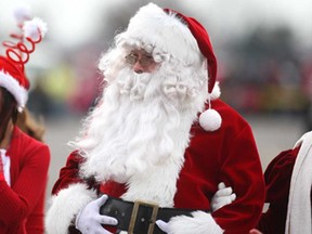 Santa Claus is joined by Mrs. Claus and some elves after arriving at Devonshire Mall by helicopter, Sunday, Nov. 16, 2014.   (DAX MELMER/The Windsor Star)