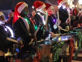 Drummers from The Diplomats, a Windsor drum and bugle band, march down Sandwich Street in Amherstburg, Saturday, Nov. 22, 2014, during the annual Santa Claus parade.  (RICK DAWES/The Windsor Star)