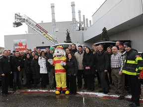 Chrysler Canada's Windsor Assembly Plant employees donated more than $30,000 worth of items to Sparky's Toy Drive on Thursday, Nov. 20, 2014. The toys will benefit local needy children during the holiday season. Chrysler employees and members of the Windsor Fire and Rescue Services which sponsor the drive pose for a group photo.    (DAN JANISSE/The Windsor Star)