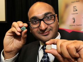 Ravinder Saini of BioSensive is shown Tuesday, Nov. 4, 2014, at the Windsor Essex Tech Show held at the Caboto Club in Windsor, ON. He has developed earrings that can monitor heart rate and other vitals signs. (DAN JANISSE/The Windsor Star