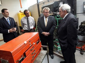 In this file photo, pictured is MP Jeff Watson, Waseem Habash,  Ed Holder, Minister of State, and John Strasser (left to right) taking part in a tour of the Ford Centre for Excellence in Manufacturing at St. Clair College in Windsor on Monday, June 30, 2014.        (Tyler Brownbridge/The Windsor Star)
