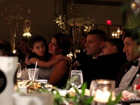 Members of the Francis-Prince family watch a tribute video during the mayor's tribute dinner Saturday, Nov. 8, 2014. Around 800 people filled Augustus Hall at Caesars Windsor for the send-off. (RICK DAWES/The Windsor Star)