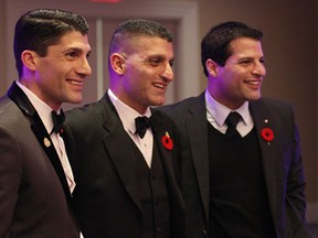 Brothers, from left to right, Roger, Eddie and Fred Francis pose for photos after the mayor's tribute dinner Saturday, Nov. 8, 2014. Around 800 people filled Augustus Hall at Caesars Windsor for the sendoff. (RICK DAWES/The Windsor Star)
