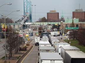 Trucks back up for several kilometres in the northbound lanes of Huron Church Road in Windsor, Ontario on November 11, 2014.   A computer glitch at United States customs caused major delays in all inbound traffic enter the USA.(JASON KRYK/The Windsor Star)