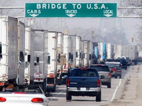 U.S.-bound transport trucks snarl Huron Church Road on their way to the Ambassador Bridge in this 2003 file photo. (Jason Kryk / The Windsor Star)