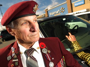 Local veteran Bob Kelly, 78, is pictured next to his van, Friday, Nov. 7, 2014, where he recently found a obscene gesture placed on the windshield.  Kelly believes he was targeted because he is a veteran.  (DAX MELMER/The Windsor Star)