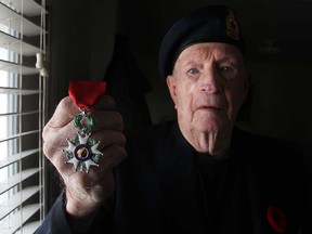 Second World War veteran, Syl Bedard, 93, pictured in his home Sunday, Nov. 16, 2014, was awarded the Knight of the National Order of the Legion of Honour.  The medal is one of France's highest national honour.  (DAX MELMER/The Windsor Star)