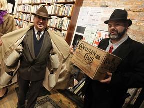 Rob Baker and Rob Tymec (right) play up the rum runners history during the official re-opening of Walkerville in Windsor on Friday, November 21, 2014.  (TYLER BROWNBRIDGE/The Windsor Star)