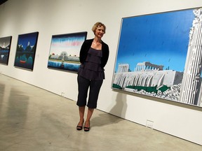 Art Gallery of Windsor director Catharine Mastin is seen with a David Thauberger exhibit at the AGW in this photo from last July. (Tyler Brownbridge / The Windsor Star)