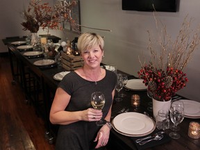 Owner Katie Robinson stands next to the new 18-seat harvest table at The Chef Next Door to The Twisted Apron. (DAX MELMER / The Windsor Star)